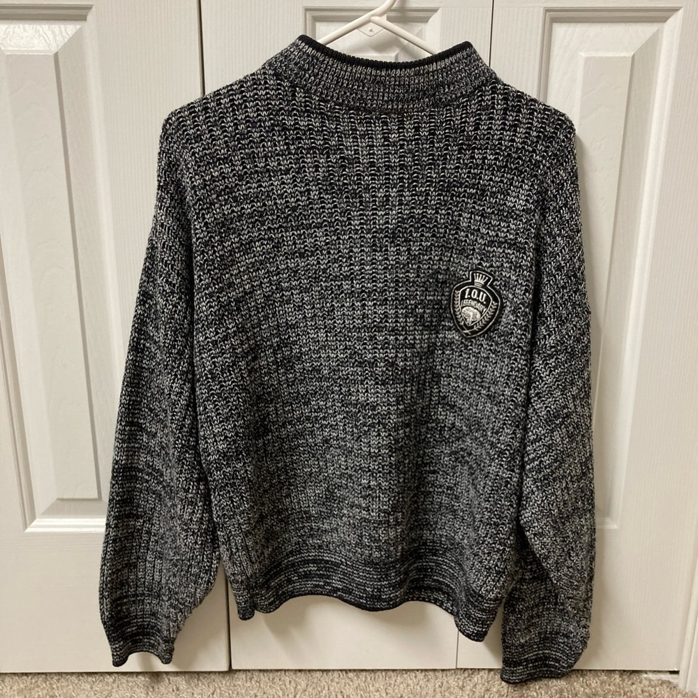 Black and white mock neck knit sweater